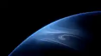 A blue swirling planet sweeps in from the lower right, brushstroke cloud bands wrapping the surface, Blue Planet wallpaper