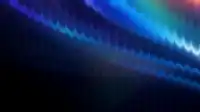 Warm sunrise glow in the bottom-left corner fading into deep navy and faint blue arcs, calm fractal aura wallpaper
