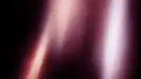 Two vertical rose light beams against deep black with visible grain texture, hero gradient noise Hero Haze wallpaper