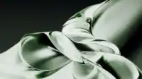Bundled rope of glass tubes coiling around each other in viscous green folds on pale sage, Liquid Emerald wallpaper
