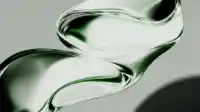 S-curved double-loop of green glass ribbon twisting through the frame, soft studio surround, Liquid Emerald wallpaper