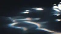 Wavy cool-blue caustics ripple across a dark plane, like light bending through water, soft Prism Leaks background