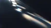 Bright window-shaped highlights cluster upper-left with diagonal beams trailing down, sharp Prism Leaks wallpaper